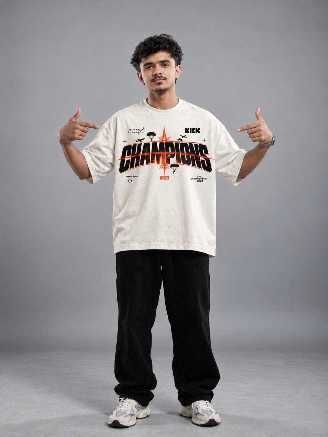 Team Apex Gaming Free Fire MAX Champions Tee in off-white, front, worn with black trousers