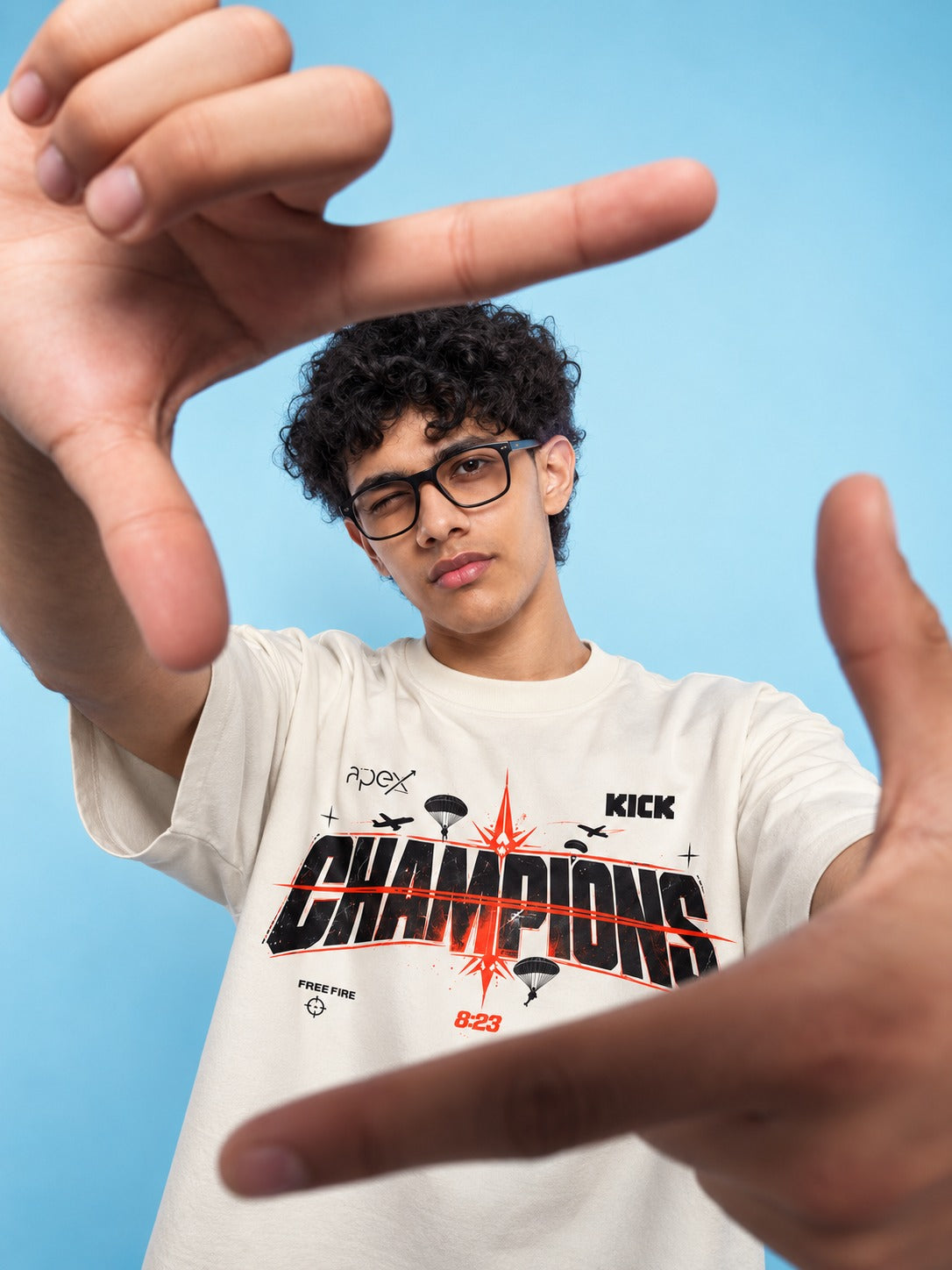 Close-up of the CHAMPIONS print with the Team Apex Gaming, Free Fire and KICK marks and 8:23