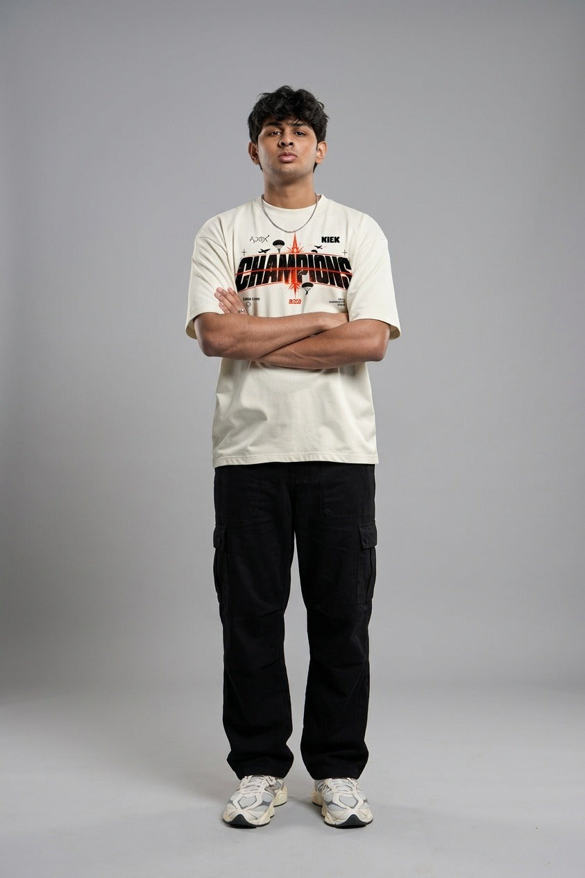 Champions Tee, arms crossed, full length